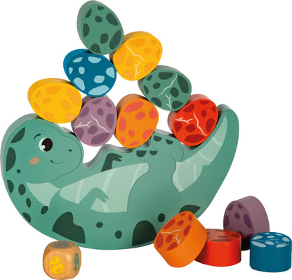 Igra ravnoteže "Dino" | Paket sadrži jednog balansirajućeg dinosaura, dvanaest jaja i jednu kockicu (broj dijelova: 14).